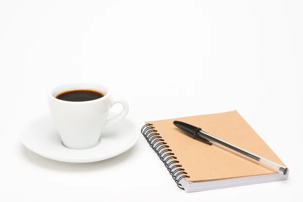 Taza de café con cuaderno — Foto de Stock