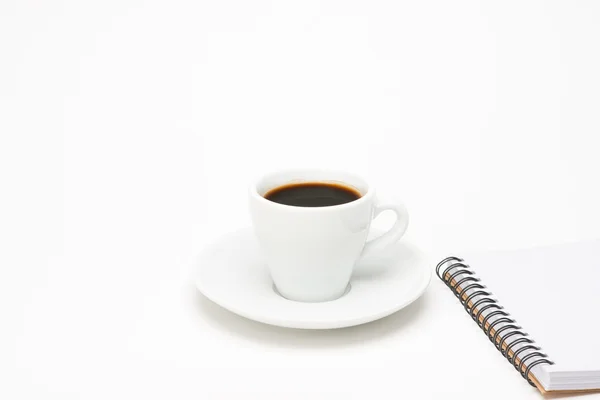 Tazza di caffè con taccuino — Foto Stock