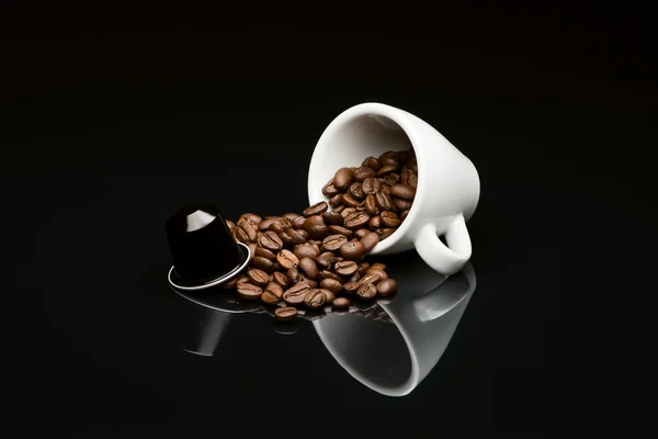 Bean's coffee cup with capsule — Stock Photo, Image