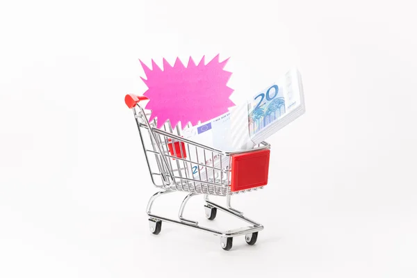 Caddy for shopping with money stack — Stock Photo, Image