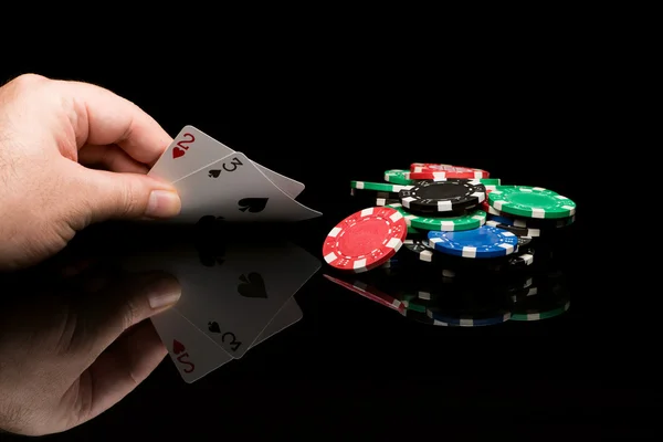 Poker cards with hand — Stock Photo, Image