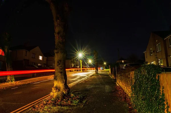 Street lights and car trails on a dark night in Penrith