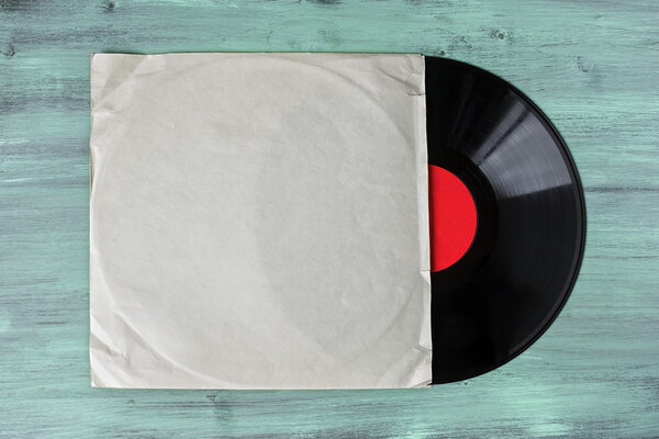 Vinyl record with white paper envelope