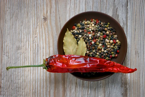 Dish with spices, bay leaf and red pepper Stock Image