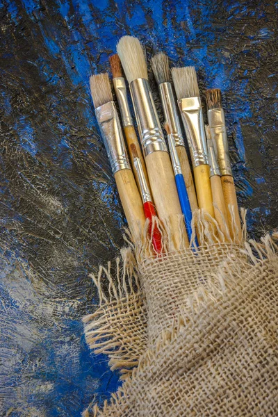 Brushes and palette with paints — Stock Photo, Image