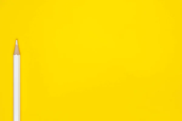 Horizontal white sharp wooden pencil on a bright yellow background, isolated, copy space, mock up — Stock Photo, Image