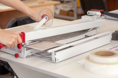 close-up metal sharp knife blade from manual guillotine for paper finishes cutting laminated sheet