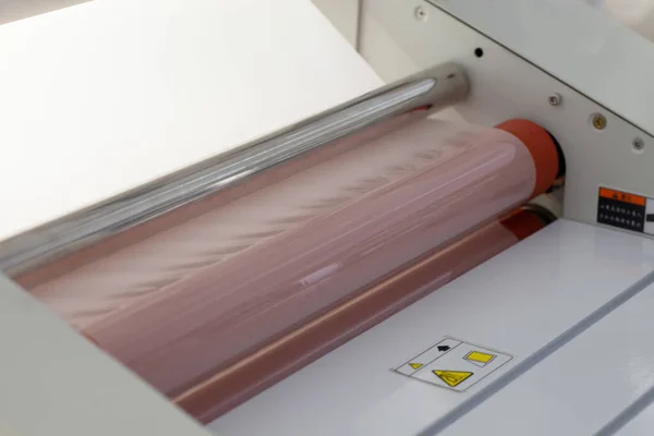 macro close-up machine for laminating paper or tags in the factory
