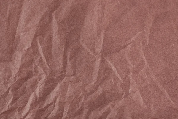 Brown color creased paper tissue background texture, wrinkled tissue paper texture