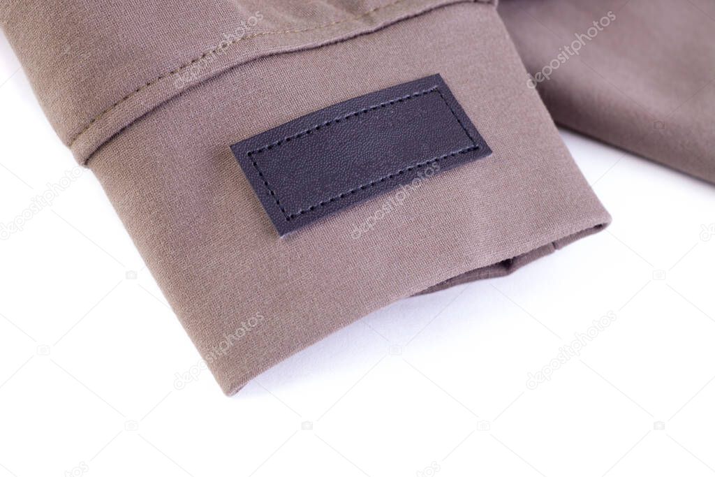 macro mock up empty eco leather brown stripe for brand logo, tag for name or clothing care instructions