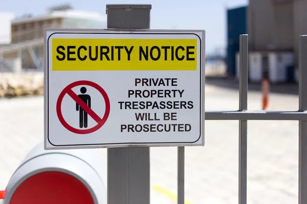 Security notice on fence. Private property Stock Photo