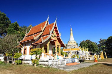 Scenery of Buddhist temple and white pagoda in Wat Luang (Luang Temple) in Pai District, Mae Hong Son Province, Thailand 