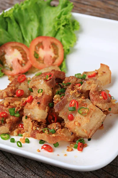 Stir Fried Crispy Pork Belly with Chili and Salt. Food photography for use in menus 