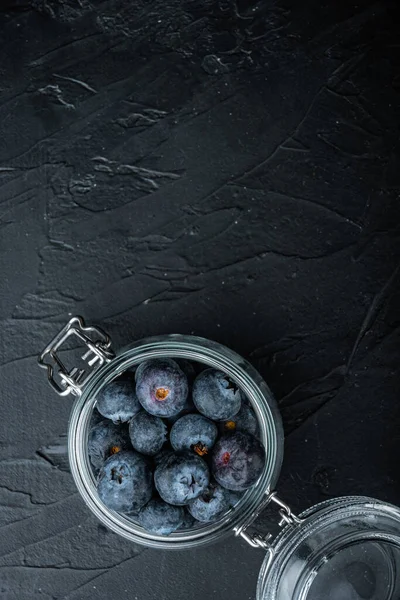 Ripe Blueberry Glass Jar Top View Space Text Black Background — Stock Photo, Image