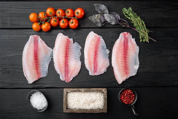 Witte Visfilet Met Ingrediënten Van Basmatirijst Kerstomaten Zwarte Houten Tafel — Stockfoto