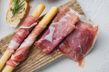 Delicious serrano ham jamon set, on white background, flat lay clipart