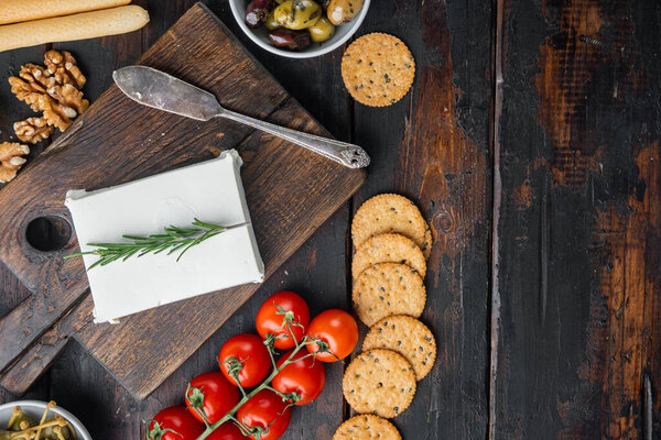 Ingredients for traditional greek salad set, on dark wooden background, top view  with copy space for text