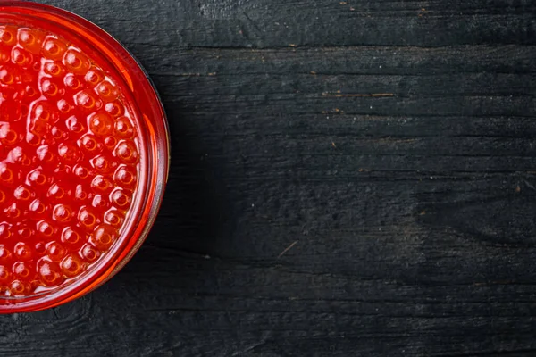 Red Salmon Caviar Jar Black Wooden Table Background Top View — Stock Photo, Image