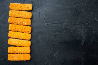 Crispy Fish fingers set, on black background, top view flat lay , with copyspace  and space for text clipart