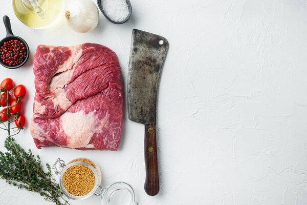 Brisket flat cut, raw beef brisket meat set,with ingredients for smoking  making  barbecue, pastrami, cure, on white stone  background, top view flat lay,  with copy space for text