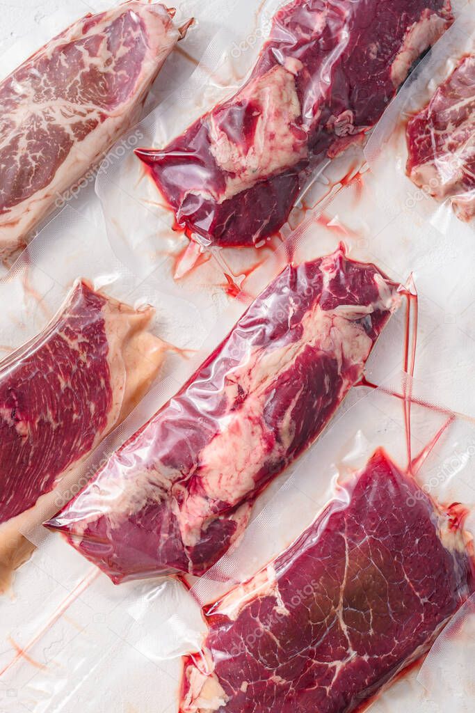 Set  of  vacuum packed organic raw beef steaks  alternative cuts