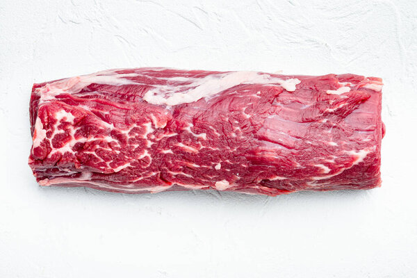 Tenderloin, or Eye Fillet cut raw marbled beef meat set, on white stone  background, top view flat lay