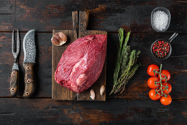 Beef meat cut raw set, on wooden cutting board, on old dark  wooden table background, top view flat lay
