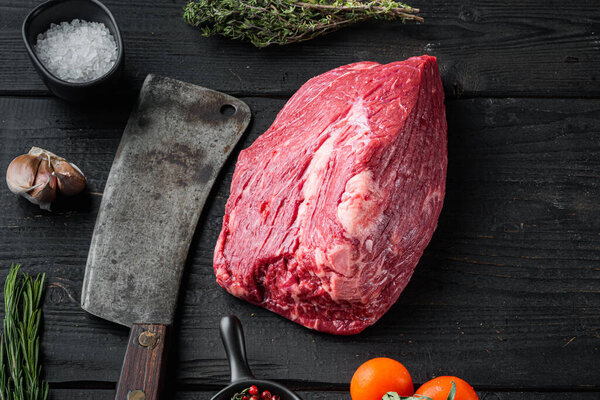 Marble beef raw set with old butcher cleaver knife, on black wooden table background