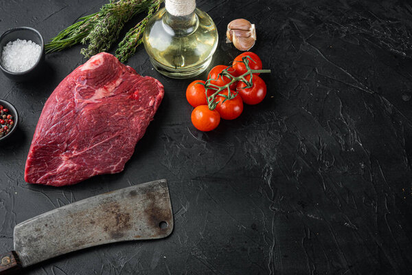 Round beef meat raw set with old butcher cleaver knife, on black background, top view flat lay,  with copy space for text