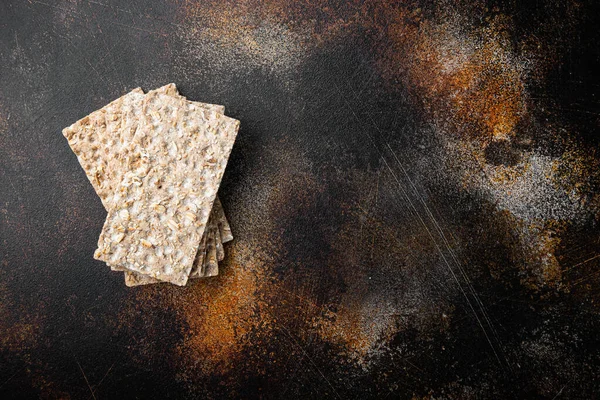 Low calories snack bread set, on old dark rustic table background, top view flat lay, with copy space for text