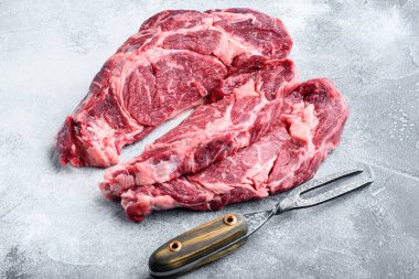 Siyah Angus bifteği, mermer et seti, gri taş arka planda.