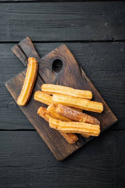 Churros Con Azúcar Salsa Chocolate Sobre Fondo Mesa Madera Negra — Foto de Stock