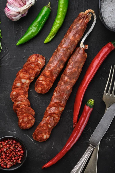 Spanish Chorizo Sausage Slices Herbs Spices Black Textured Background — Stock Photo, Image