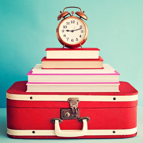 Vintage alarm clock over books — Stock Photo, Image