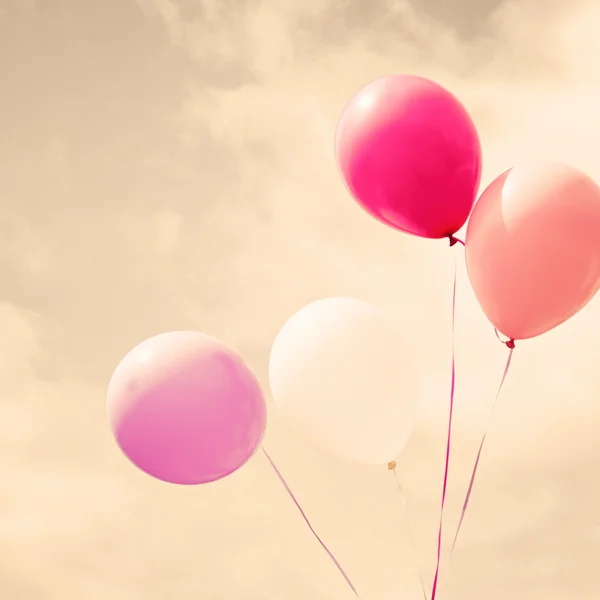 Colorful balloons over vintage sky — Stock Photo, Image