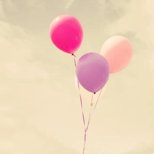 Colorful balloons over vintage sky — Stock Photo, Image