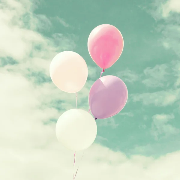 Colorful balloons over vintage sky — Stock Photo, Image