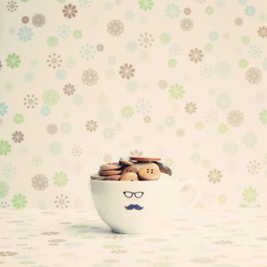 Cup full of buttons clipart