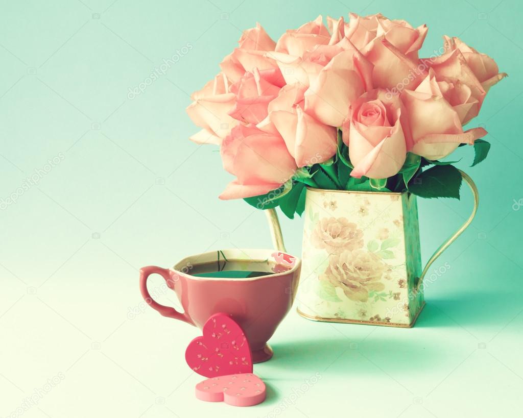 Roses in vase and hearts with cup of coffee