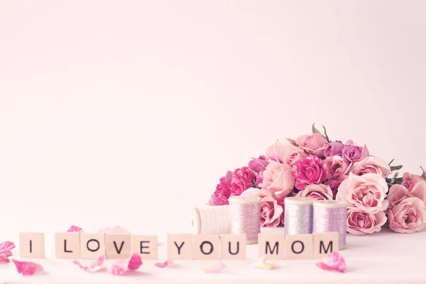 Pink peonies and roses on table — Stock Photo, Image