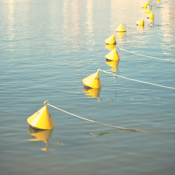 Yellow buoys in water — Stock Photo, Image