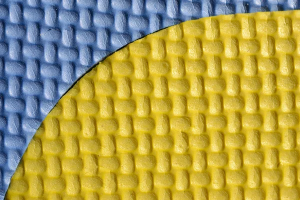 Gelb und blau Schaumstoffboden Hintergrund — Stockfoto