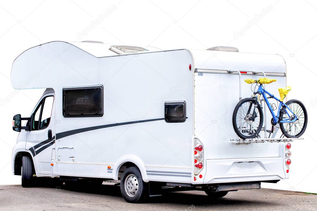 A caravan van with a bicycle on at the back on white  background, isolated.