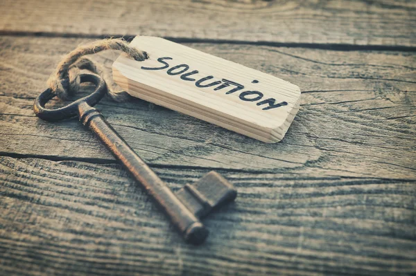 Old key with solution sign — Stock Photo, Image