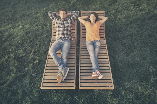 Couple resting on the couch — Stock Photo, Image