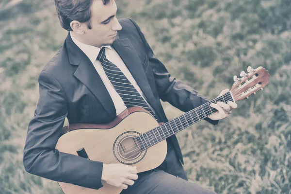 Boy playing a guitar