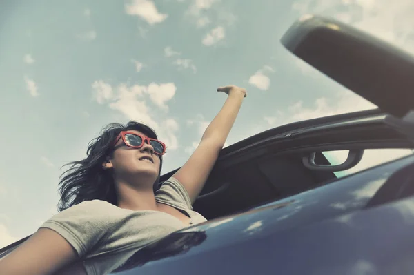 Girl looks out the window when riding in a car