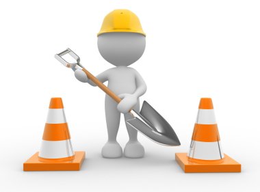 Kişi trafik konileri ve kürek ile