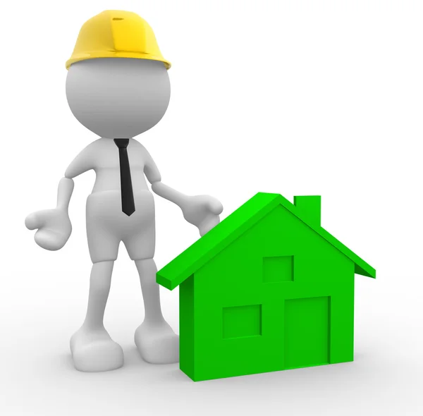 Builder in helmet with a house — Stock Photo, Image