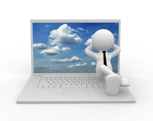 Man sitting on laptop with sky on screen — Stock Photo, Image